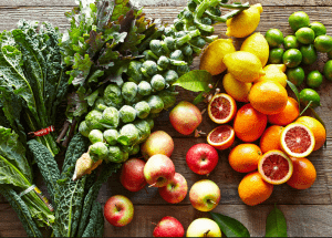 a group of fruits and vegetables on a wood surface Healthy Weight Loss Diets Newcastle
